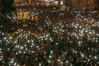 Intersection between Hennessy Road and Johnston Road in Wan Chai. Protesters have turned on their phone flashlights.