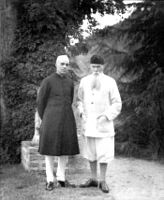 Jawaharlal Nehru (left) wearing an achkan with churidar.[13]