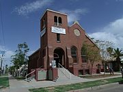 The First Missionary Church was built in 1928 and is located at 902 E. McKinley in Phoenix's historic Garfield neighborhood. The architecture of the structure is that of Mission Revival. It is designated as a landmark by the Historic Preservation-Landmark (HP-L) overlay zoning (PHPR).