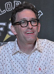 Smiling middle-aged man wearing glasses