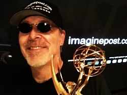 Chris Julian with Emmy Award