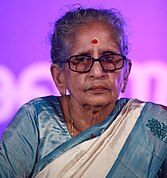 A photograph of a woman man with spectacles