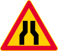 Road narrows on both sides