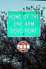 Sign promoting the One-Arm Dove Hunt.