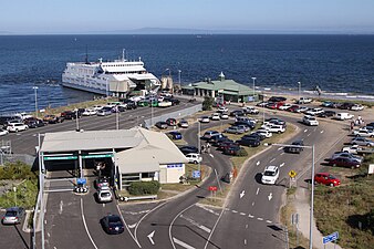 Ferry terminal for the Peninsula Searoad Transport service, with cars leaving a ferry