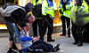 Ian Tomlinson remonstrates with police after being pushed to the ground, minutes before he died.