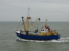 Fishing vessel equipped with a benthic dredge, leaving the port of Nieuwpoort