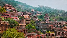 Neemrana Fort ( Chouhan Clan ) Located 10 km away is a heritage hotel now .