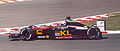 Mark Webber's Minardi PS02 features "Go KL" branding at the 2002 French Grand Prix due to the identity of his Malaysian teammate, Alex Yoong.