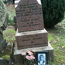 Marble gravestone with inscription "A token of esteem to the memory of Caroline E D Martyn, born at Lincoln 3rd May 1867, died at Dundee 23rd July 1896. A devoted worker in the cause of humanity. Erected by Socialist comrades and Dundee Textile Workers Union."