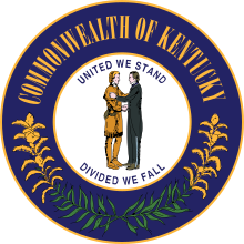 A seal depicting two men shaking hands encircled by the words "United we stand, divided we fall". Further out, the words "Commonwealth of Kentucky" and two sprigs of goldenrod encircle the inner part of the seal