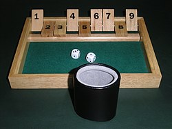 Shut the box game with dice cup