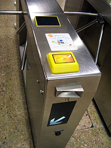 An MTR ticket gate with an Octopus reader