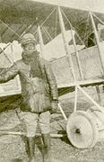 Bullard beside a Caudron trainer