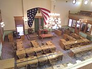 A view from the fourth floor of the Arizona State Capitol Museum looking down from the gallery into the original House Chamber.