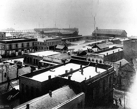 First, the pre-Fire configuration, seen from the northeast. Oregon Railroad and Navigation Company's City Dock at left, Ocean Dock at right. Together, these are between Jackson and Washington Streets. (You can also see the King Street Coal Wharf to the left; that was rebuilt after the Fire, but I won't be touching on that again here).