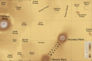 Map of Tharsis quadrangle with major features indicated. Tharsis contains many volcanoes, including Olympus Mons, the tallest known volcano in the Solar System. Ceraunius Tholus, although it looks small, is about as high as Earth's Mount Everest. The locations of some fossae are shown.