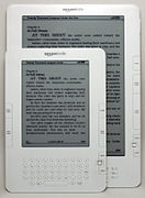 A Kindle DX underneath a Kindle 2