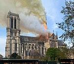 Notre-Dame de Paris, with its spire and roof aflame