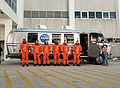 Melvin (center) with STS-129 crew members boarding the astrovan