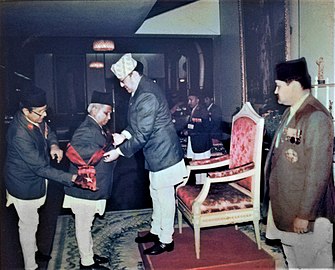 Receiving Gorakha Dakshin Baahu (First Order) from the then King Birendra