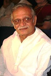 Gulzar, pictured in 2008, is smiling away from the camera.