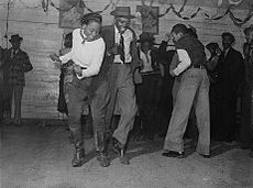 Dancing in a juke joint outside Clarksdale, Mississippi; November 1939.