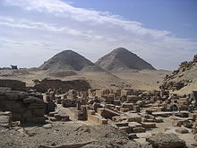 A photograph of two pyramids