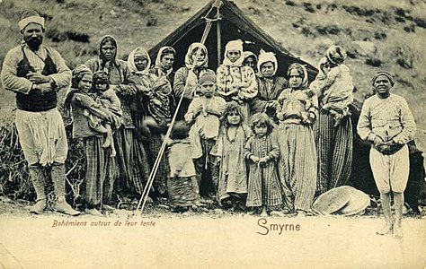 Postcard of a Muslim Romani Men with his 8 Wives and 10 Children, in front of their tent in Smyrna (today İzmir) in 1903