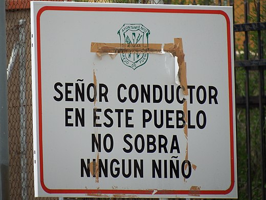 The sign reads "Mr. Driver in this town we don't have any children left". We call this España vaciada, the Emptied Spain. Villarejo de Fuentes