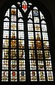 Stained glass window in the church donated by A.J. Enschedé with Laurens Janszoon Coster on the left and a typesetter's workshop on the right.