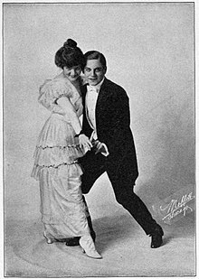 Louise Alexander and John Jarrott demonstrate a dance step in 1914.