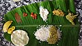 Sadya, a traditional platter originated from the Indian state of Kerala, served on Banana leaf