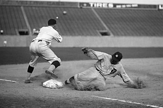 Ty Cobb sliding into third