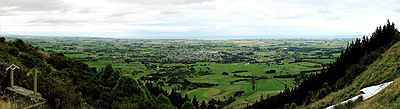 This is a panorama of the view from the White Horse above Waimate, in New Zealand. Waimate can be seen near the centre, while part of the White Horse can be see on the lower right