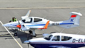 Twin-engine plane next to a single-engine plane