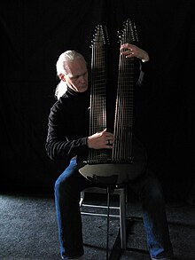 Kevin Kastning with the 36-string Kevin Kastning Signature Double Contraguitar by Emerald Guitars