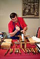 Image 22A traditional bookbinder at work (from Bookbinding)