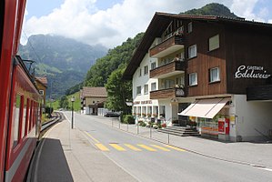 Side platform next to village street with buildings