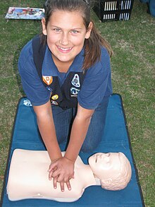 Voortrekker girl receiving first aid training. She is wearing the new (current) style uniform.