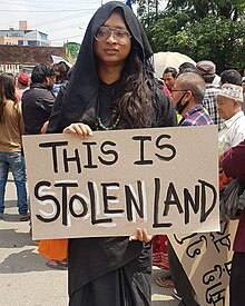 Woman holding placard