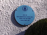 The Blue Plaque on the wall of a Cottage in Beeston Road, Sheringham, marks the location of Sheringham watermill (Paper).