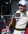 Craig Dolby with his race winner's trophy at Silverstone Circuit (2010)