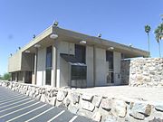 The Farmers & Stockmens Bank was built in 1950-1951 and is located at 5001 E. Washington St. It was listed in the Phoenix Historic Property Register in October 2004.