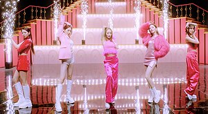 Image of Kara members dancing dressed in pink
