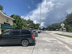 A former gas station now serving as commercial building on Florida SR 26 and Grove Street.