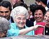 Chiara Lubich, smiling, surrounded by other smiling people