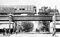 A steam train on the Lake Street Elevated Railroad