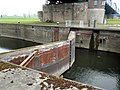 Old canal lock in the canal under the bridge