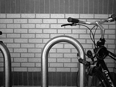Grayscale test image of brick wall and bike rack